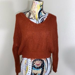 Burnt orange distressed sweater. Size: XS.
